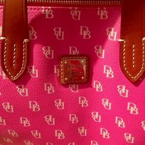 Dooney & Bourke duffle type handbag for sale.